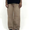 Brown wide-leg pants with elastic waist, relaxed streetwear fit, worn casually for everyday comfort and modern styling.
