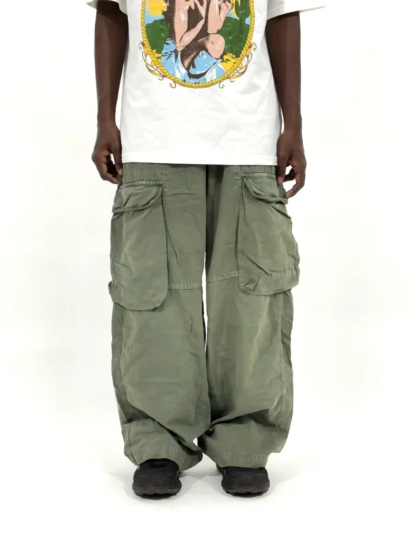 Budget friendly jean pants in olive wide fit, relaxed streetwear pants for men, styled casually, online clothing store under 1000 pants.