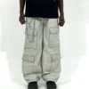 Ash grey wide-leg cargo pants with elastic waist and utility pockets, styled for modern streetwear, offering a relaxed fit and everyday comfort from an online clothing store under 1000.