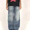 Stone blue wide-leg denim pants with relaxed fit and elastic waist, styled for modern streetwear and daily wear.